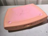 a pink nintendo wii game console sitting next to a pink nintendo wii game console
