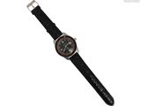 une image représentant une montre noire avec un cadran marron et un bracelet noir