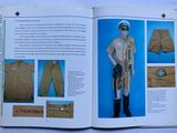 an open book with a picture of a man in uniform