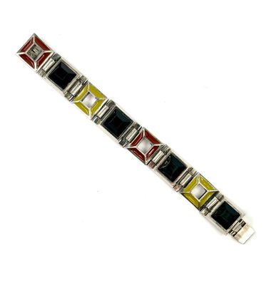 a close up of a bracelet on a white surface