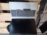 a laptop computer sitting on top of a wooden pallet