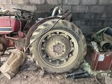 a large tire that is sitting on the ground next to other items