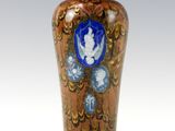 a vase that has a blue and gold design on it