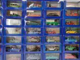 a lot of toy cars that are in a blue box