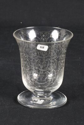an image of a clear glass cup with a small sticker on it