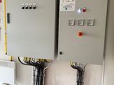 two electrical panels on the wall in the room