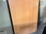 two pieces of wood sit next to each other in a room