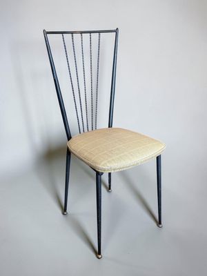an image of a chair with a seat made out of metal