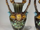 two vases that are sitting on a table