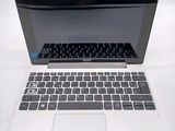 a laptop computer that is sitting on a table