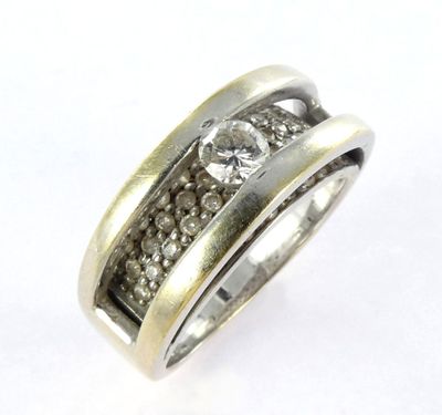 a close up of a ring with diamonds on a white background