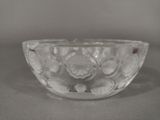 a glass bowl that has a flower design on it