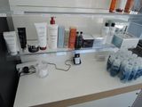 a shelf with many different types of skin care products on it