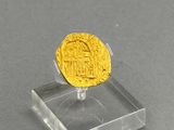 an image of a gold coin sitting on top of a clear stand