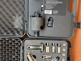 a case with tools inside of it on a table