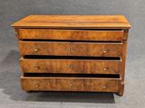 a wooden chest of drawers with four drawers on each side