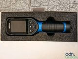 a cell phone that is in a box on the floor
