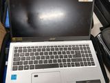 a laptop that is sitting in a suitcase on the floor