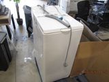 an image of a white refrigerator in a room