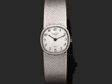 an image of a close up of a wrist watch on a black background