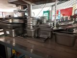 many pans on the counter in the kitchen