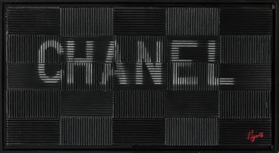 a black and white photo of a sign that says chanel