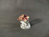a silver ring with a bouquet of flowers on it