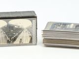 a stack of cards sitting on a table next to a box