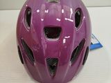 a purple helmet that is on a white table