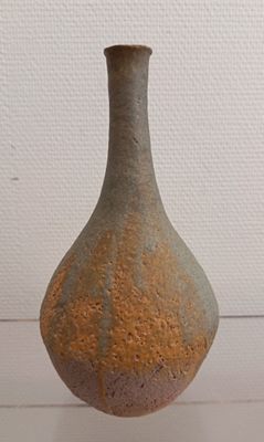 a small vase that is sitting on a table