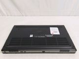 a laptop that is sitting on a white surface