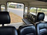 a view of the inside of a bus from the passenger seat
