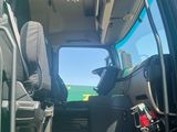 a view of the inside of a truck with the door open