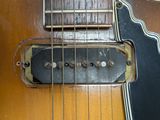 a close up of a guitar with a pickuper on it