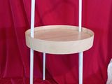 a small wooden table with a chair on top of it