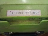 a close up of a green machine with a label on it