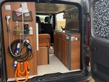 a van that has a small kitchen in the back of it