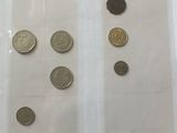 a lot of coins that are in a plastic bag