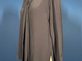 an image of a woman ' s shirt on a mannequin stand