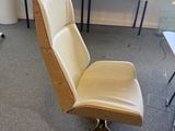 a chair that is sitting in front of a window
