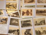 a lot of old photographs on the table