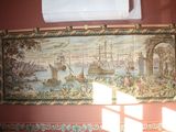 a picture of a tapestry hanging on the wall in a room