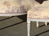 two chairs that are sitting next to each other