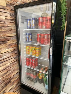 a refrigerator that has a lot of drinks inside of it