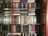a glass display case with many dvds in it