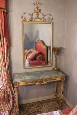 a mirror on the wall in the corner of a room