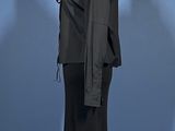 a black dress and jacket on a mannequin stand