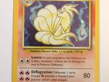 the pokemon card has a picture of a yellow flower on it