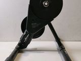 a black object on a white table with a white background