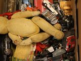 a box full of assorted toy cars and a teddy bear